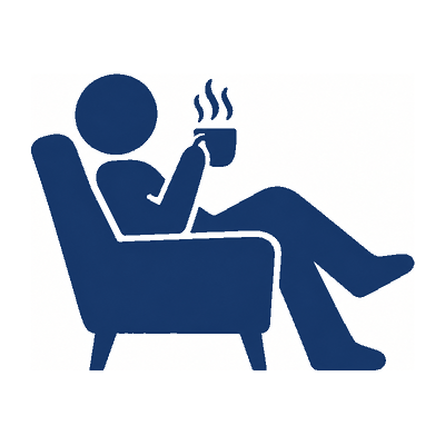 A person sitting in an armchair with a hot drink.