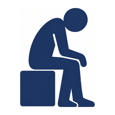 A person sitting alone with their head down.